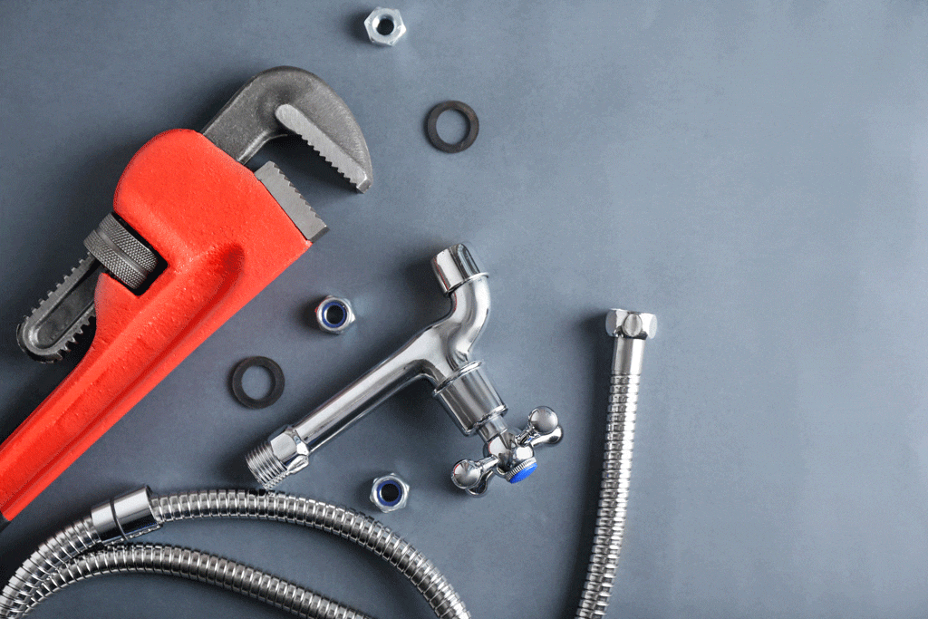 plumbing tools laying on gray background plumber conway sc myrtle beach sc