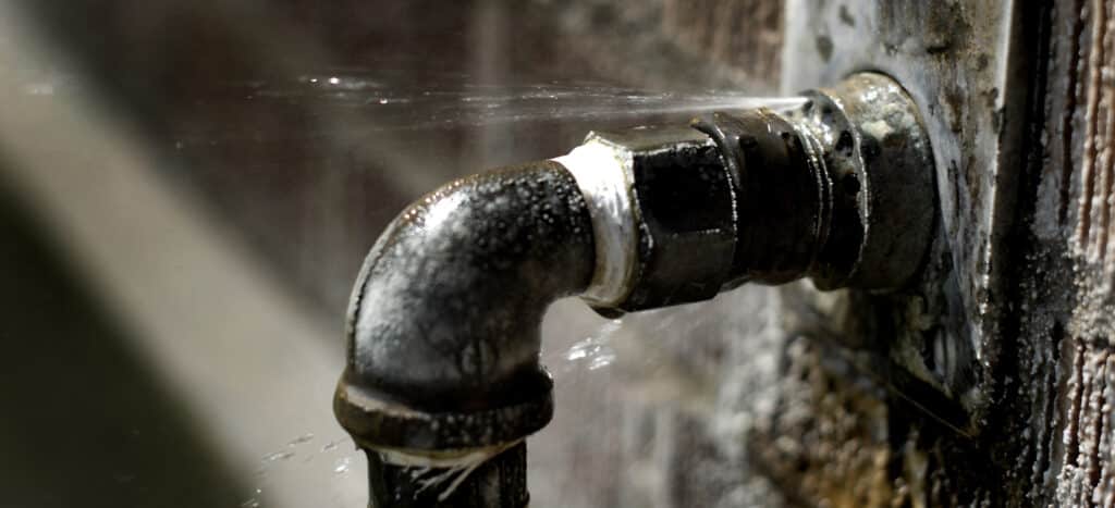 Water main breaks are a serious concern, often resulting in leaky pipes with water spraying or squirting out.