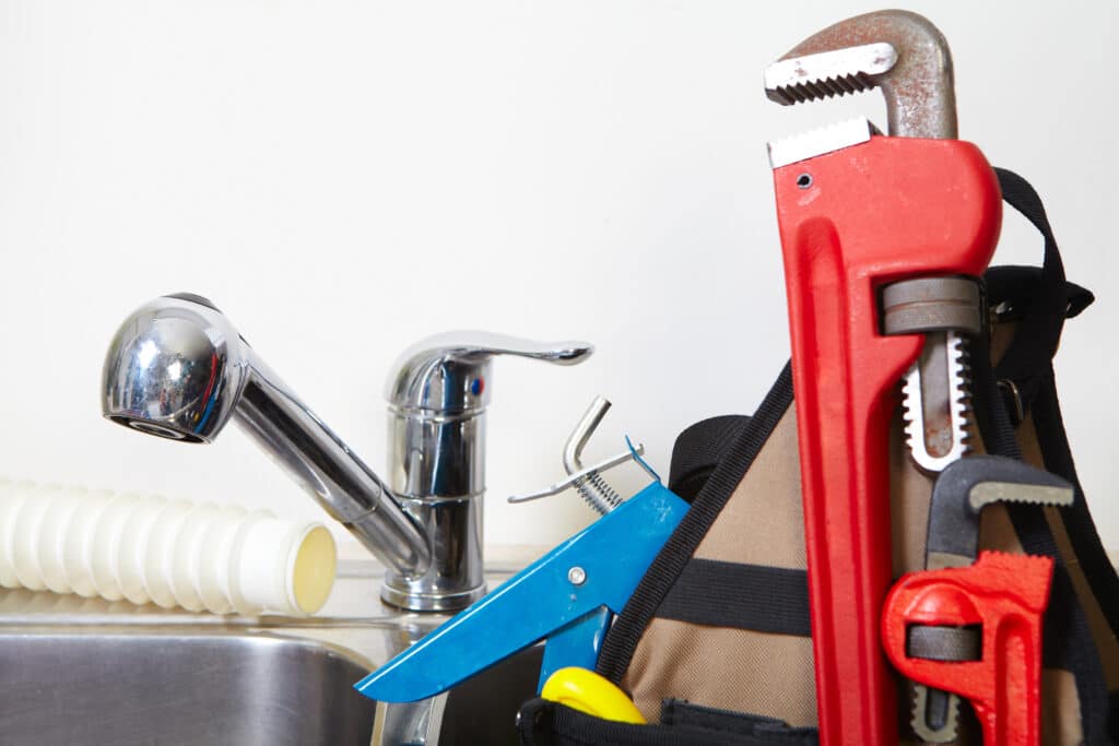 Kitchen water tap and sink plumbing maintenance.