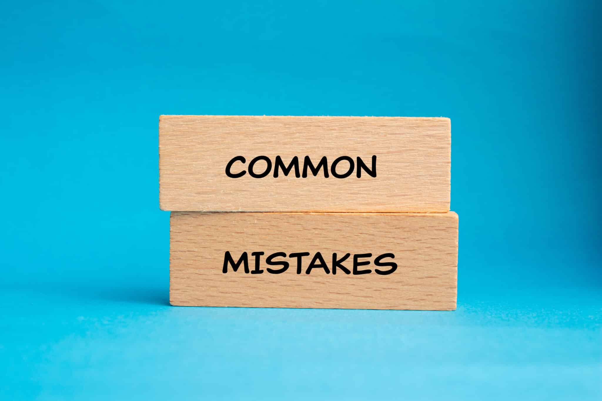 Common mistakes words written on wooden blocks with blue background, Laundry standpipe height.